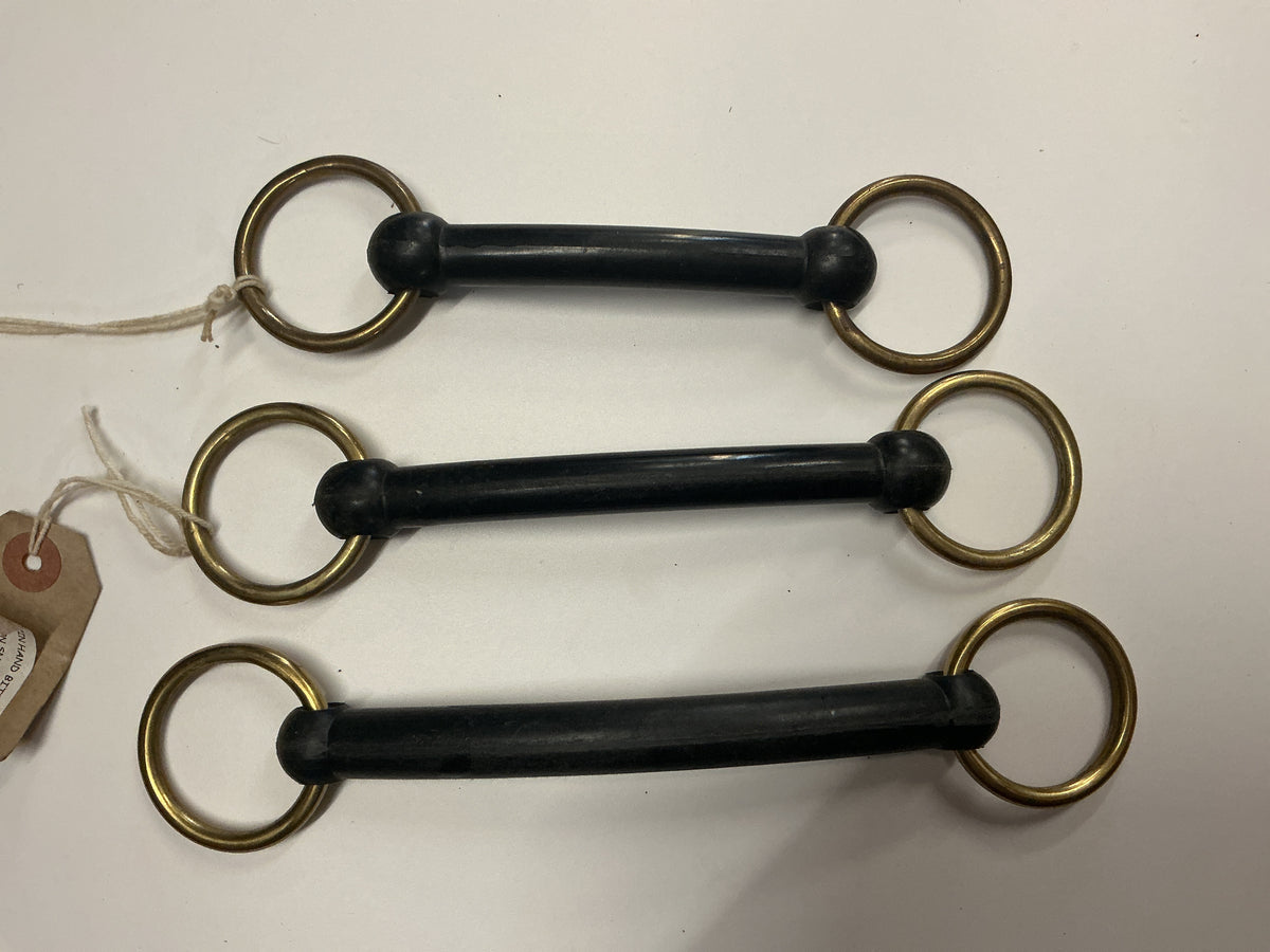 Hard rubber loose ring showing bit brass in hand